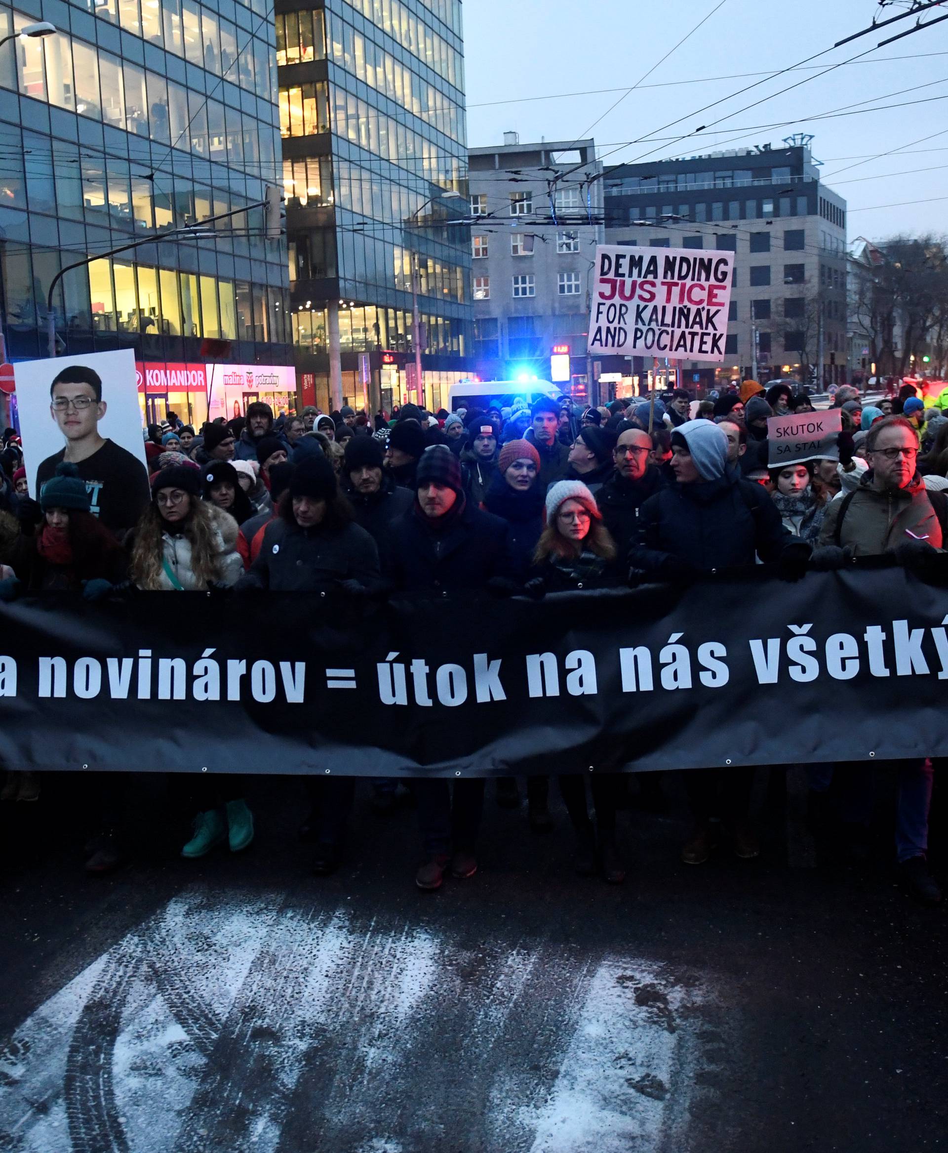 Participants march in honour of murdered Slovak investigative reporter Jan Kuciak