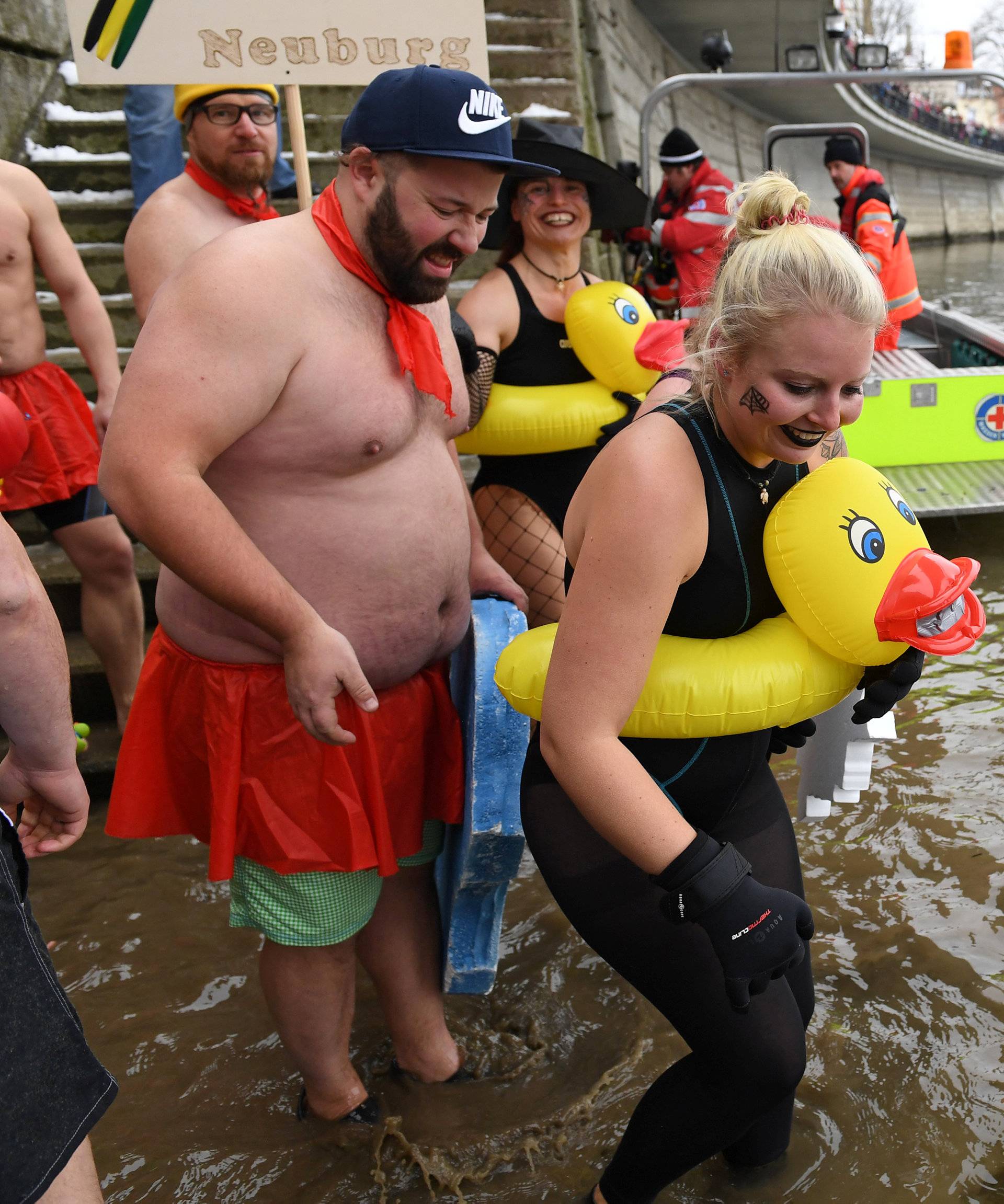 Swimmers wearing costumes bathe in the 3 degrees Celsius water of the river Danube in Neuburg an der Donau