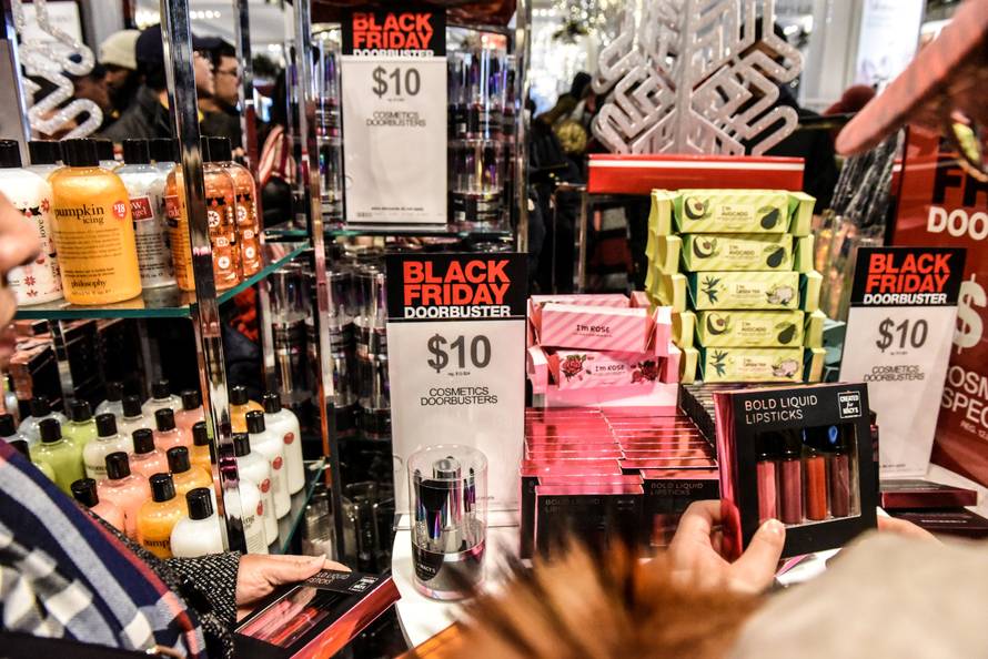 People shop during a Black Friday sales event at Macy's flagship store in New York City