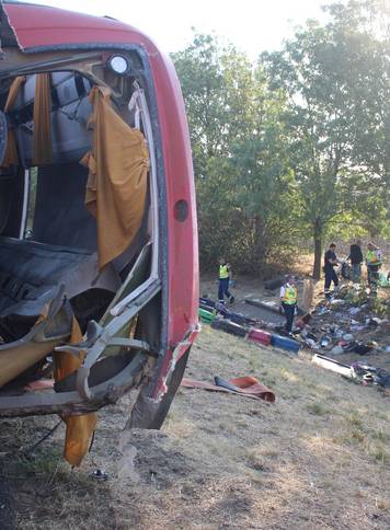 Firefighters work on the scene of a deadly accident near Mezokeresztes