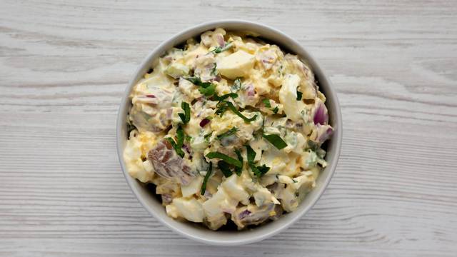 Homemade Healthy Potato Salad with Eggs in a Bowl, top view. Fla