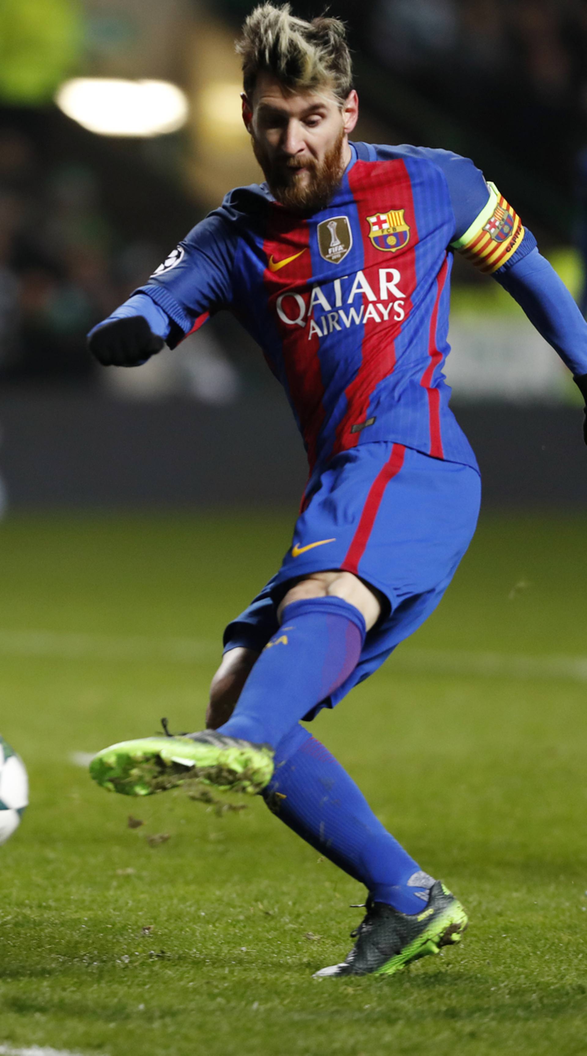 Barcelona's Lionel Messi scores their first goal