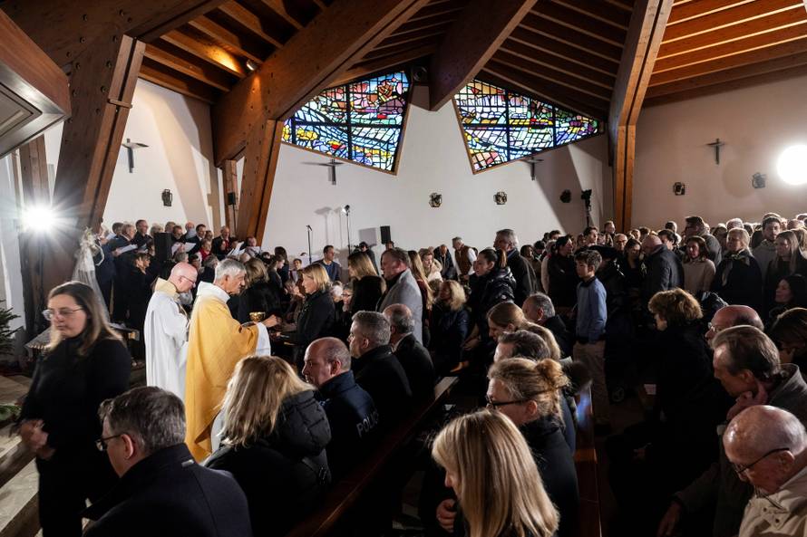 Sunday Mass at the chapel of Saint-Christophe dedicated to the victims of the fire at the 'Le Constellation' bar and lounge