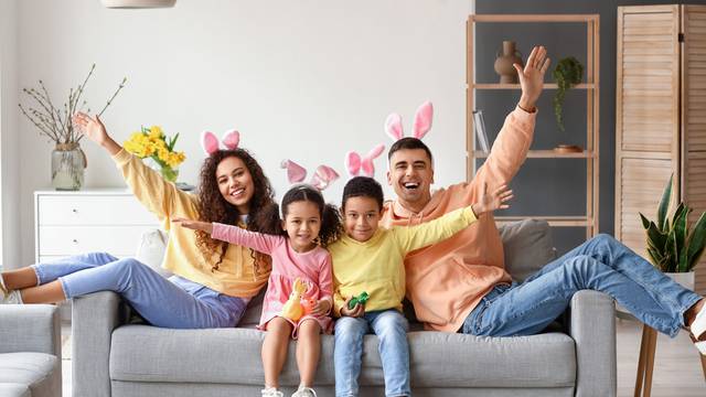 Little,Children,With,Easter,Rabbits,And,Their,Parents,Sitting,On