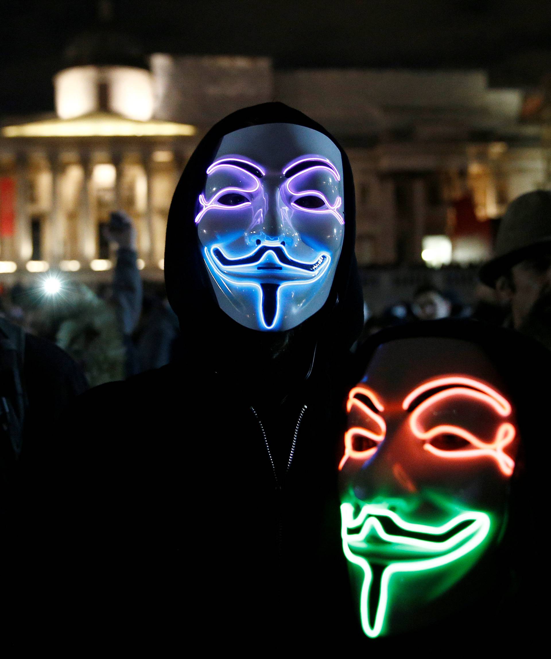 Mask wearing protesters gather before the "Million Mask March" in London