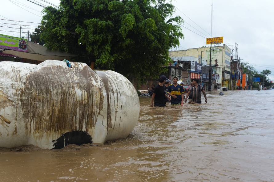 Torrential rains burst rivers, sparking floods in eastern Mexico