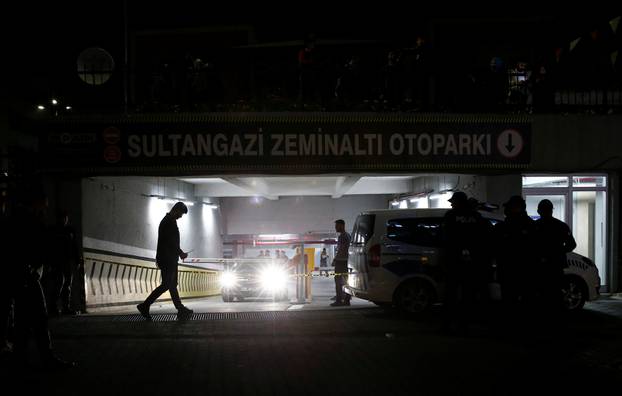 Turkish police officers stand guard outside a car park where a vehicle belonging to Saudi Arabia