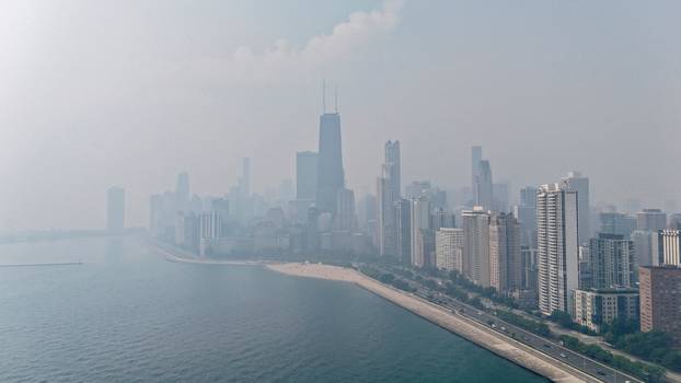 Canadian wildfire smoke shrouds the skyline in Chicago