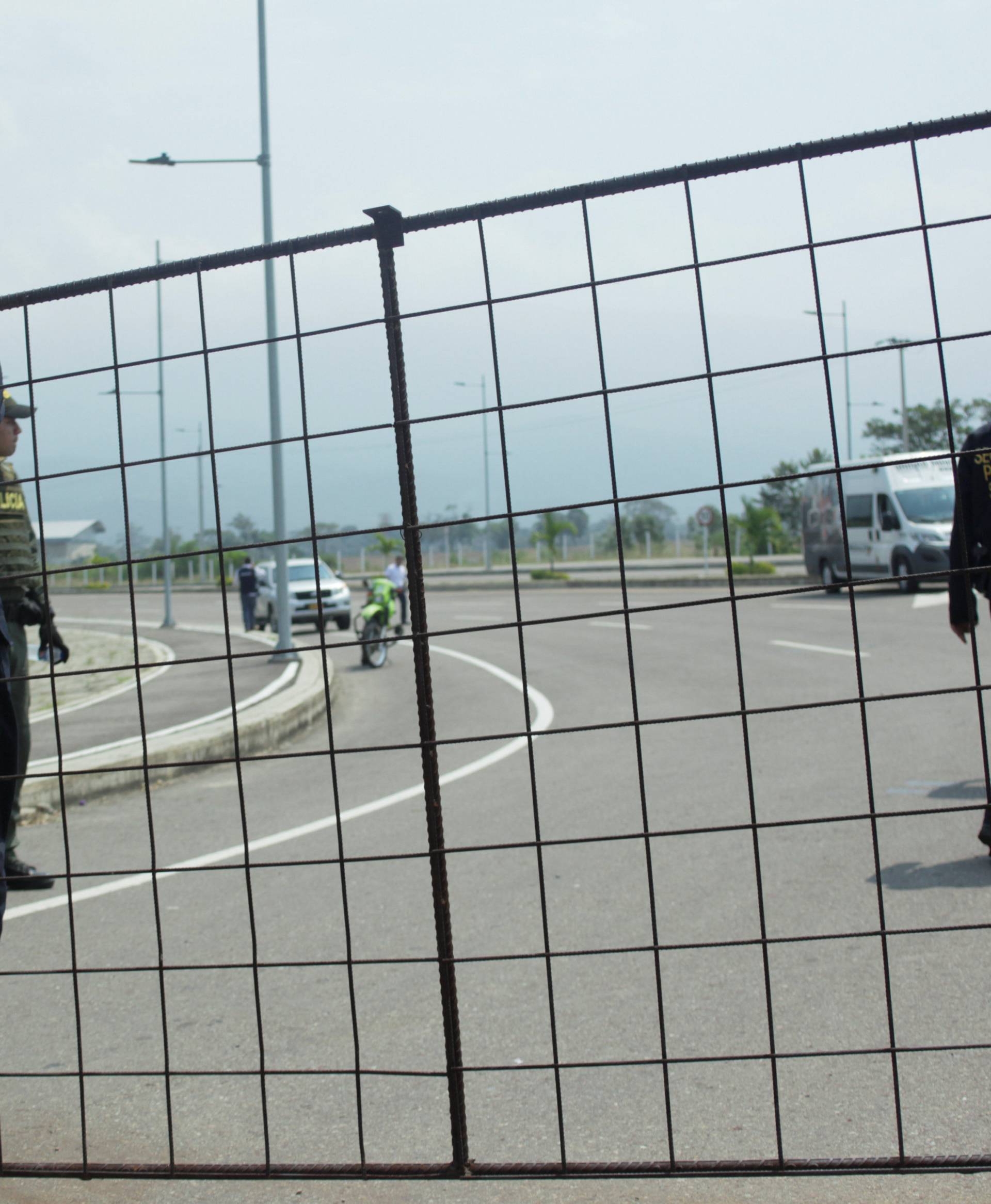 A security officer stands guard on the road to the Tienditas cross-border bridge between Colombia and Venezuela, in Cucuta