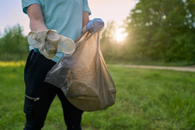 Blogging,Concept.,A,Man,Collects,Trash,From,The,Forest,In