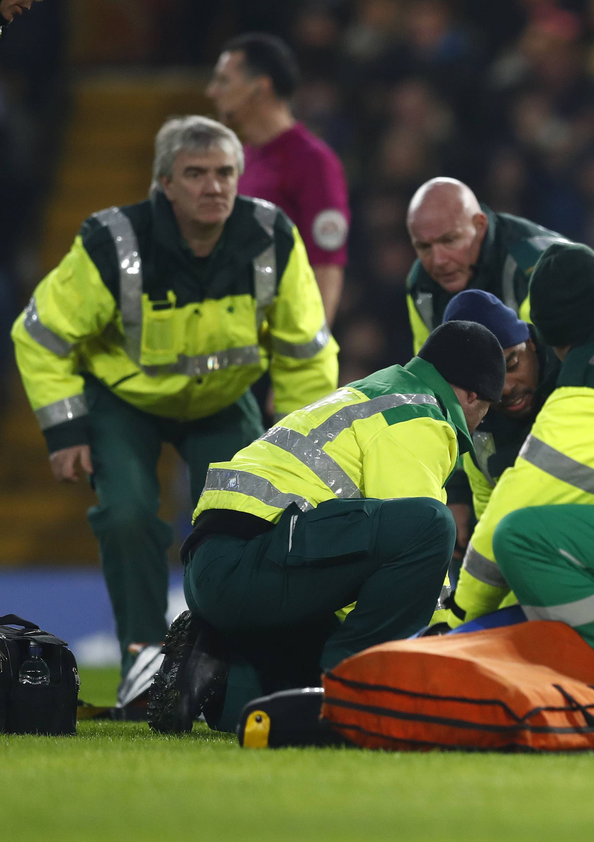 Hull City's Ryan Mason lies injured and receives medical attention