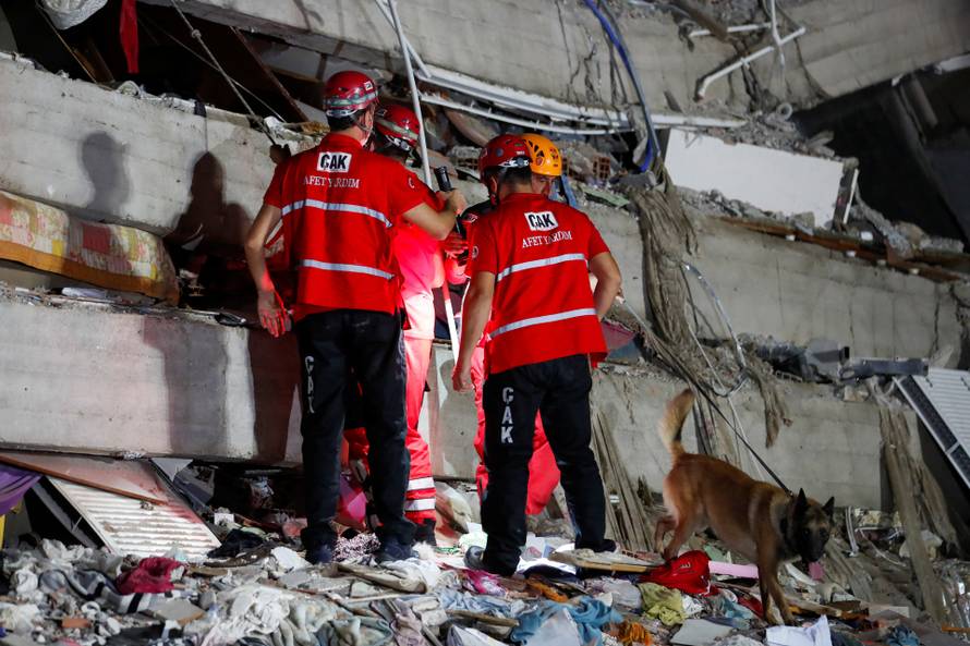 Rescue operations take place on a site after an earthquake struck the Aegean Sea, in the coastal province of Izmir