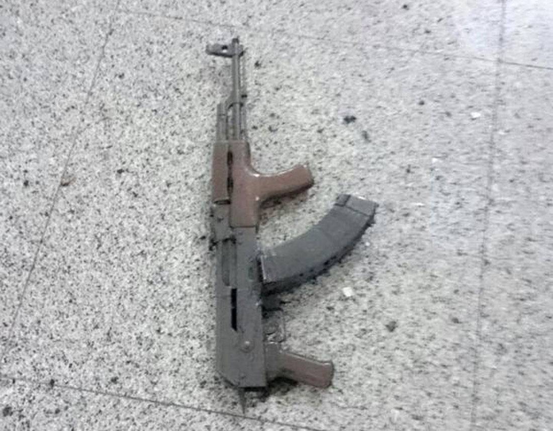 A weapon is seen on the floor at Ataturk airport after suicide bombers opened fire before blowing themselves up at the entrance, in Istanbul, Turkey