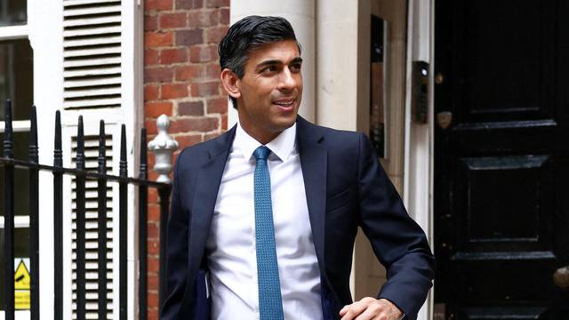 FILE PHOTO: Conservative leadership candidate Rishi Sunak leaves an office building in London