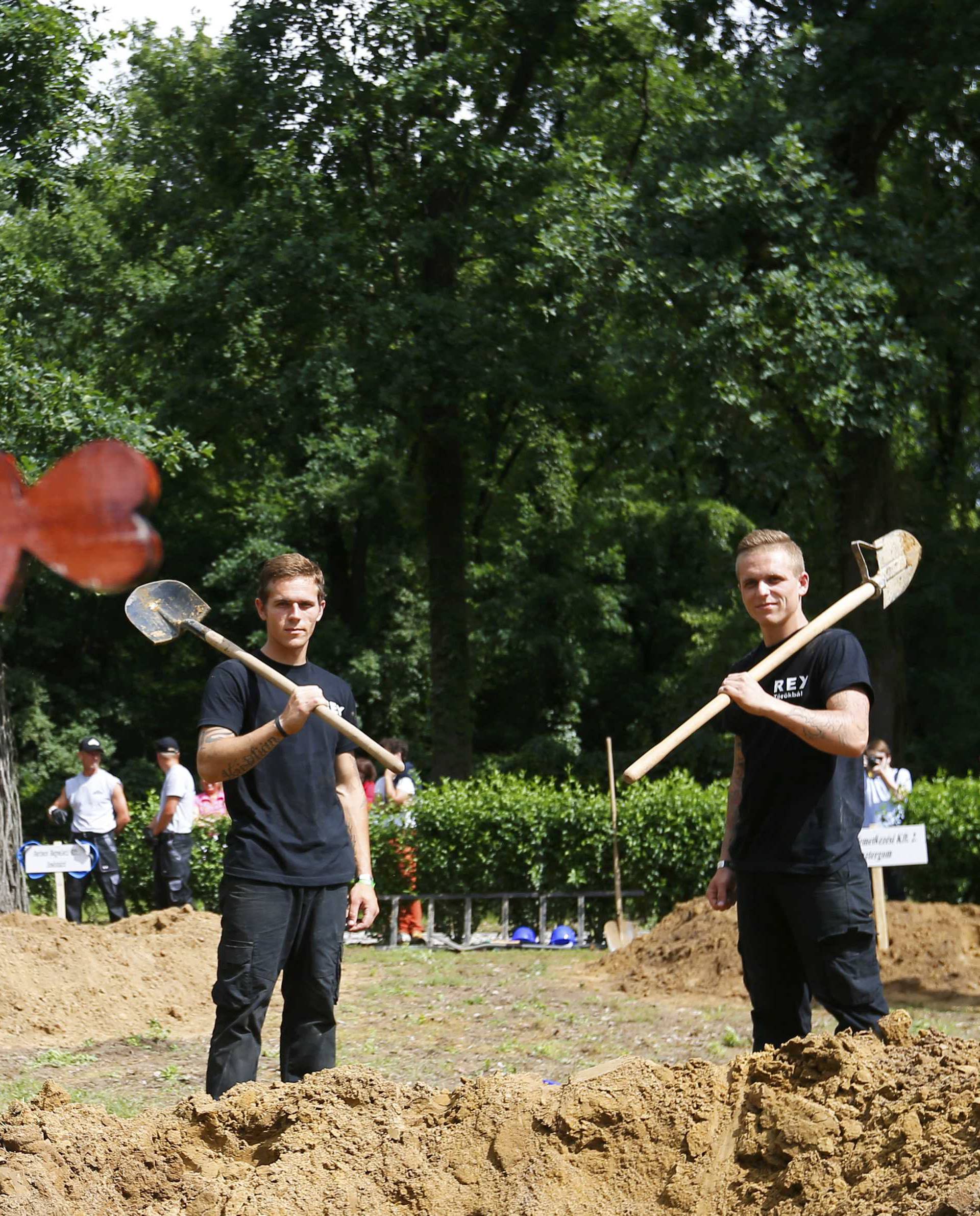 Gravediggers pose after Hungarian grave digging championship in Debrecen