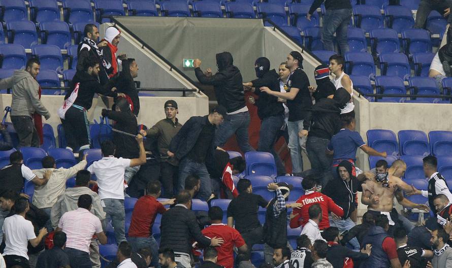 Besiktas and Lyon fans clash in the stands