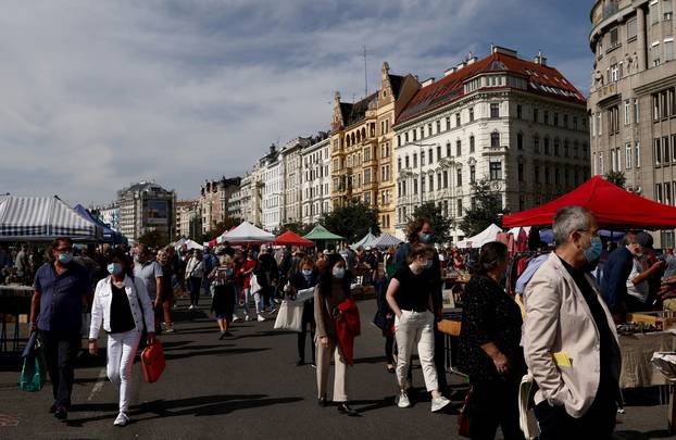 Shoppers wearing protective face masks stroll at Naschmarkt flea market as the global coronavirus disease (COVID-19) outbreak continues in Vienna