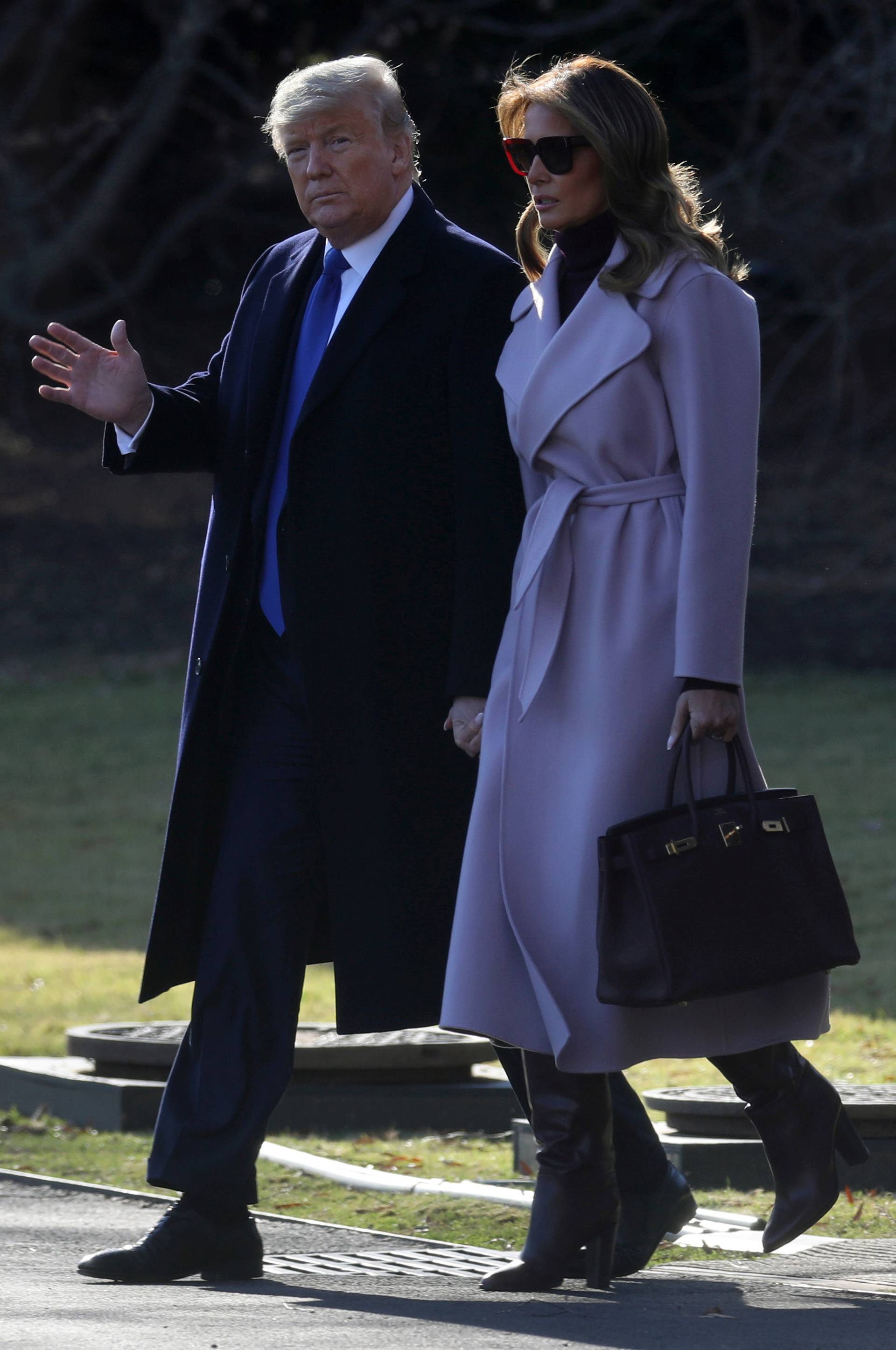 U.S. President Donald Trump boards Marine One to depart for travel to Florida