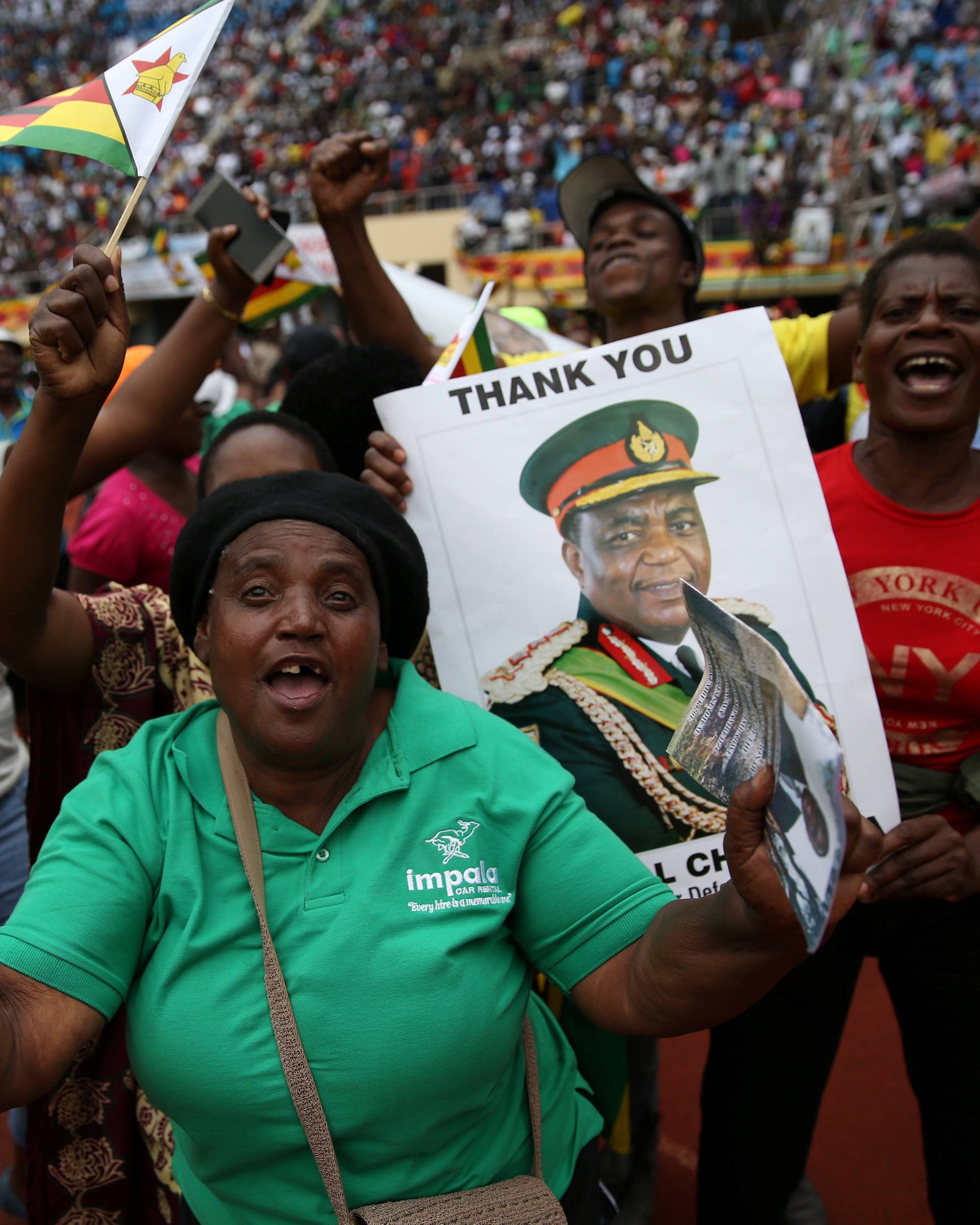 People cheer as Emmerson Mnangagwa is sworn in as Zimbabwe's president in Harare, Zimbabwe