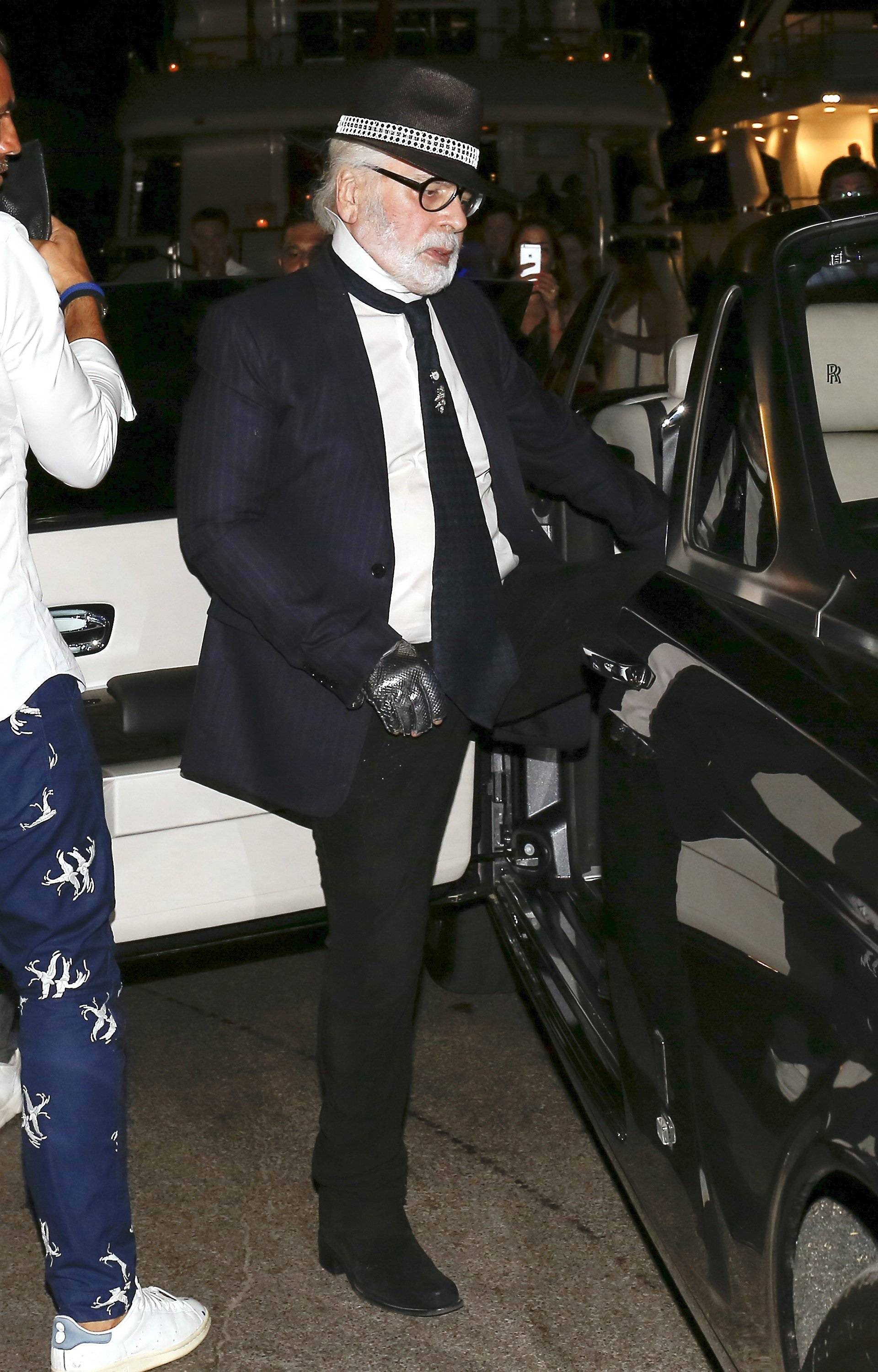 Karl Lagerfeld leaving Le Senequier in Saint Tropez