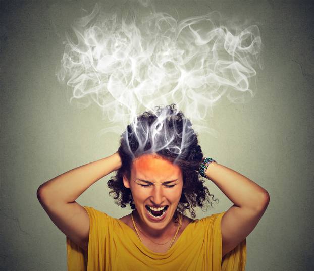 stressed woman screaming frustrated thinking too hard steam coming out of head