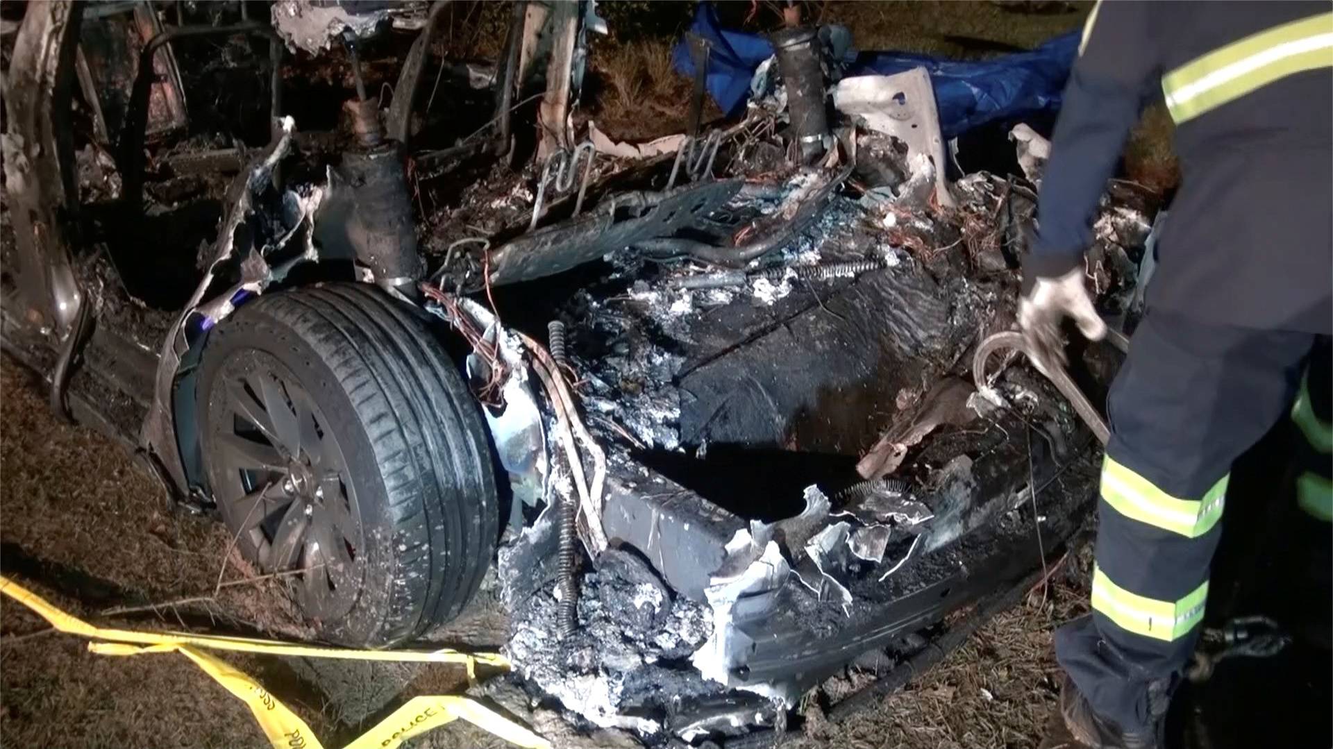 The remains of a Tesla vehicle are seen after it crashed in The Woodlands, Texas