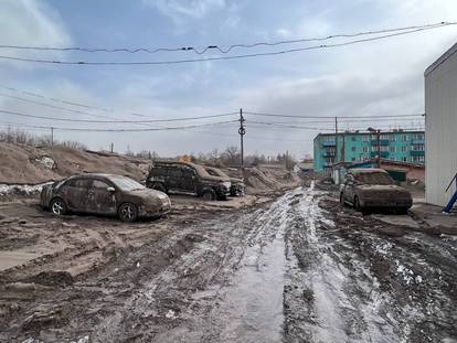 A view shows cars covered in volcanic dust following the eruption of Shiveluch volcano in the settlement of Klyuchi