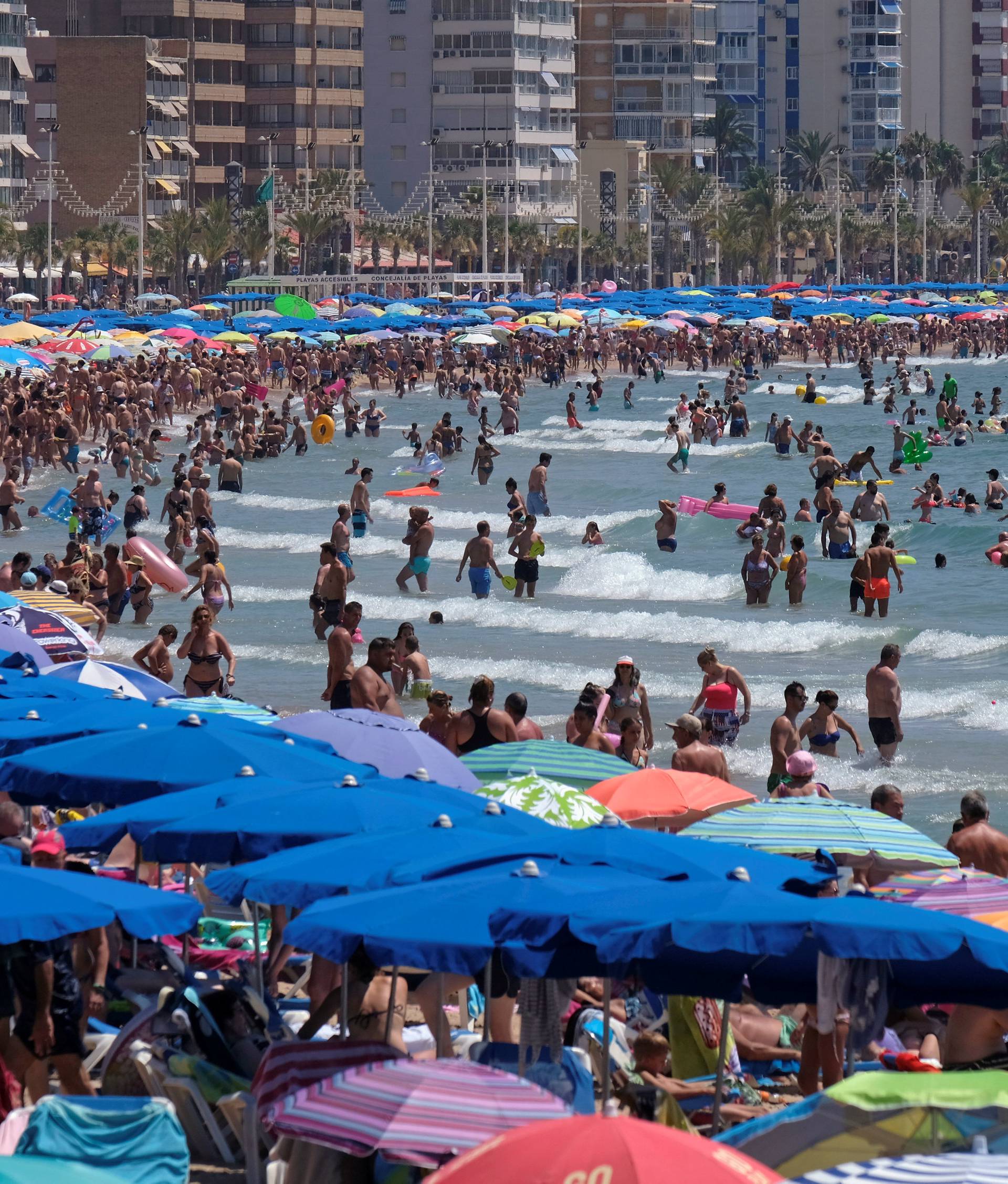 People cool off at the beach during the heatwave in the southeastern coastal town of Benidorm