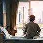 Patient,Sat,On,The,Bed,And,Looked,Out,The,Window