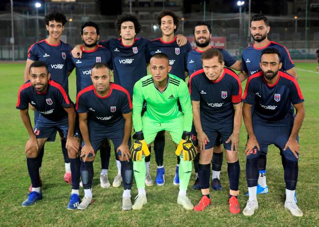 Ezzeldin Bahader (2nd R), a 74-years-old Egyptian football player of 6th October Club poses for a team group photo before a soccer match against El Ayat Sports Club of Egypt