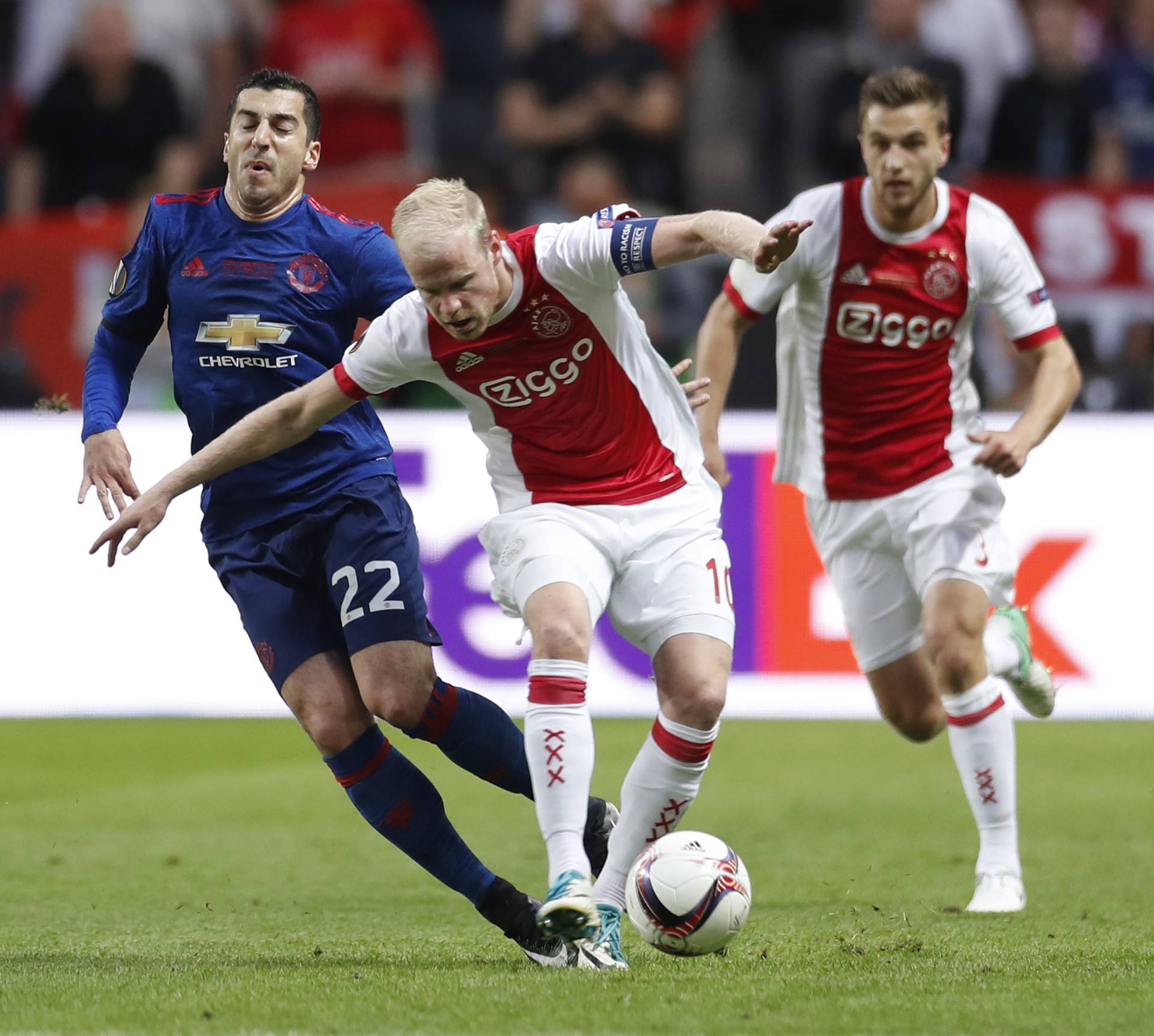 Manchester United's Henrikh Mkhitaryan in action with Ajax's Davy Klaassen