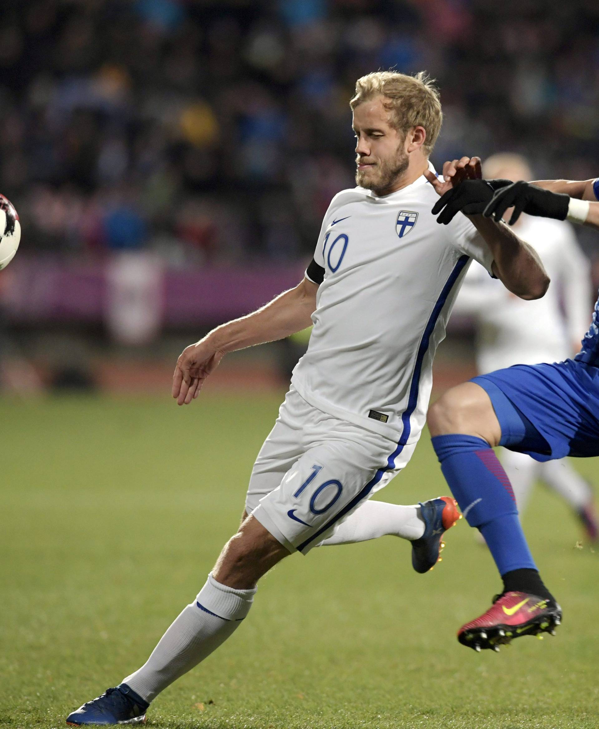 Finland's Teemu Pukki and Domagoj Vida of Croatia in action during the FIFA World Cup 2018 football qualification match between Finland and Croatia in Tampere