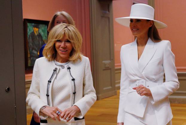 United States first lady Melania Trump and her French counterpart Brigitte Macron visit the National Gallery of Art in Washington