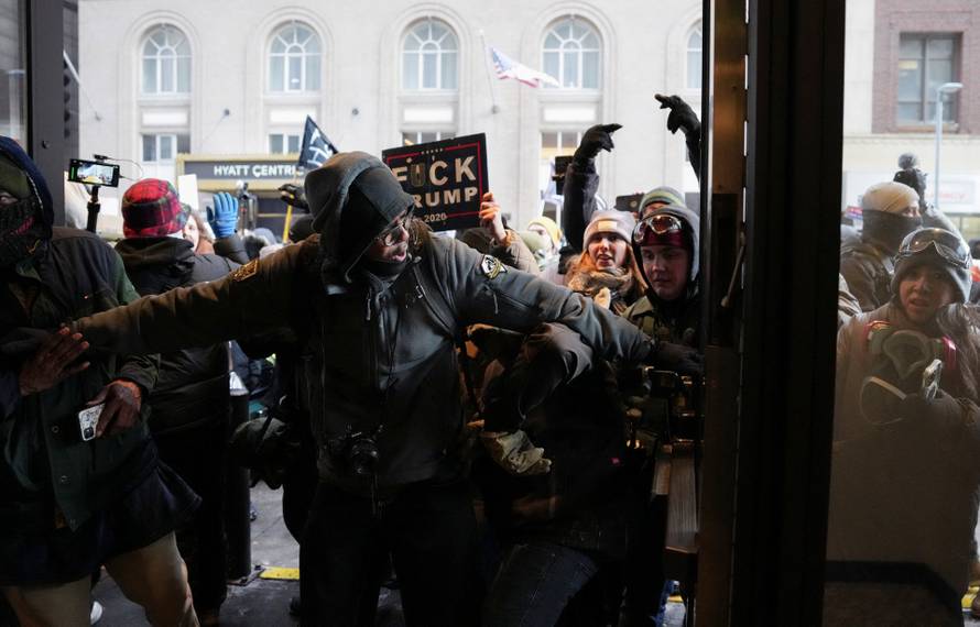 People attend the "March Against Minnesota Fraud" in Minneapolis