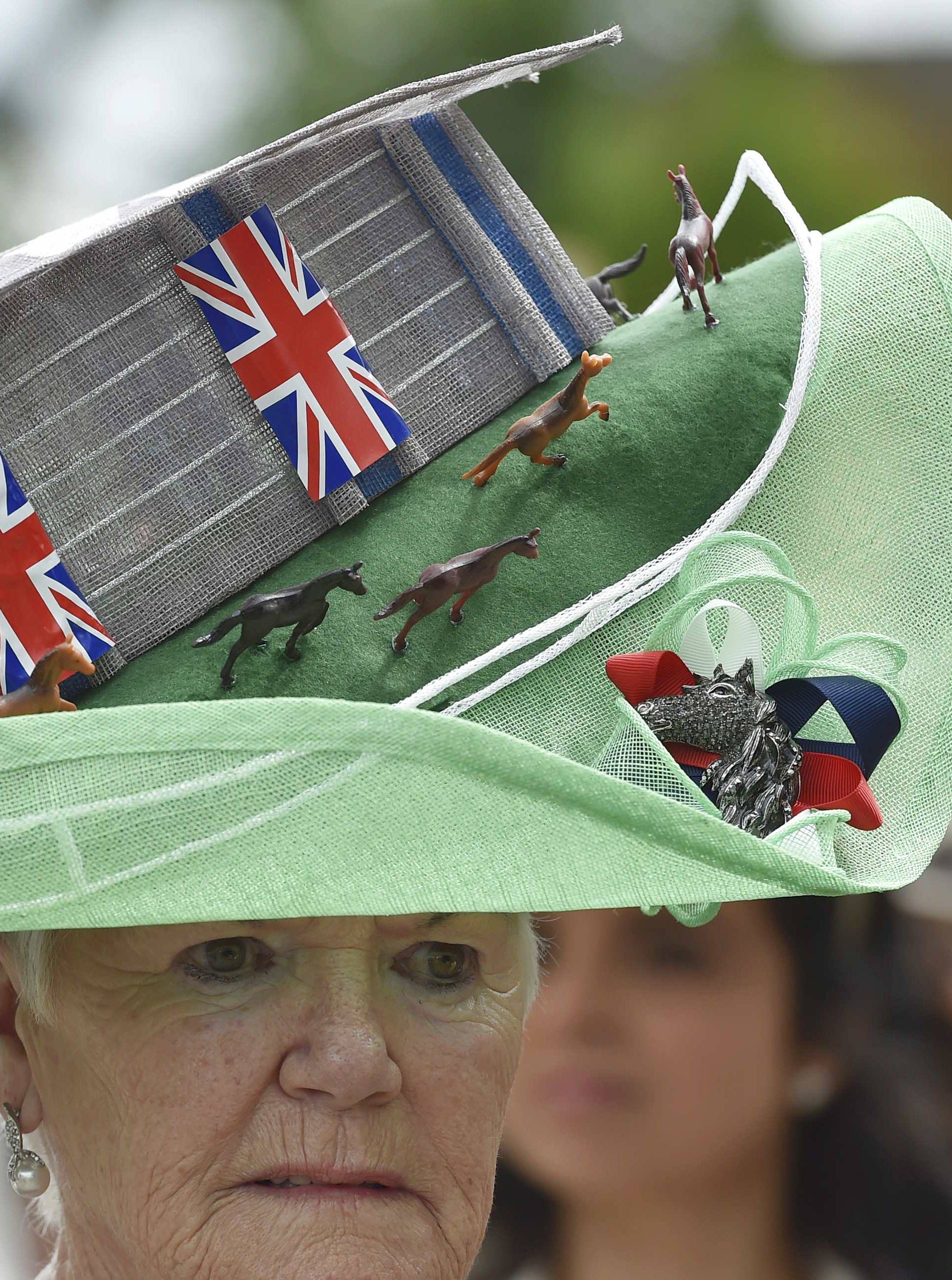 Britain Horse Racing Ladies Day Racegoer wears hat