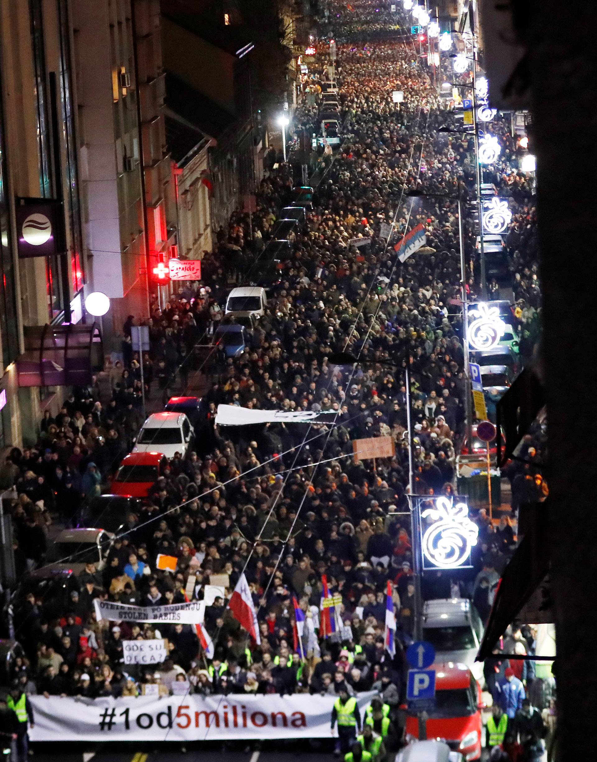  People walk during an anti-government protest in Belgrade