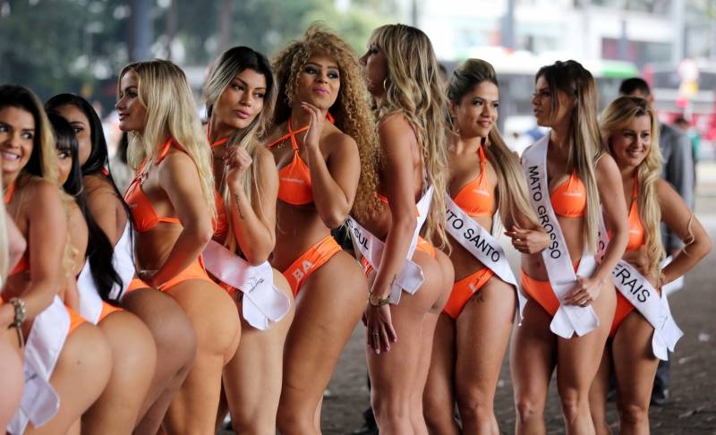Miss BumBum Brazil 2016 pageant contestants pose at Paulista Avenue in Sao Paulo's financial centre