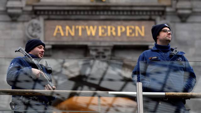Belgian police officers patrol in the central station, in Antwerp