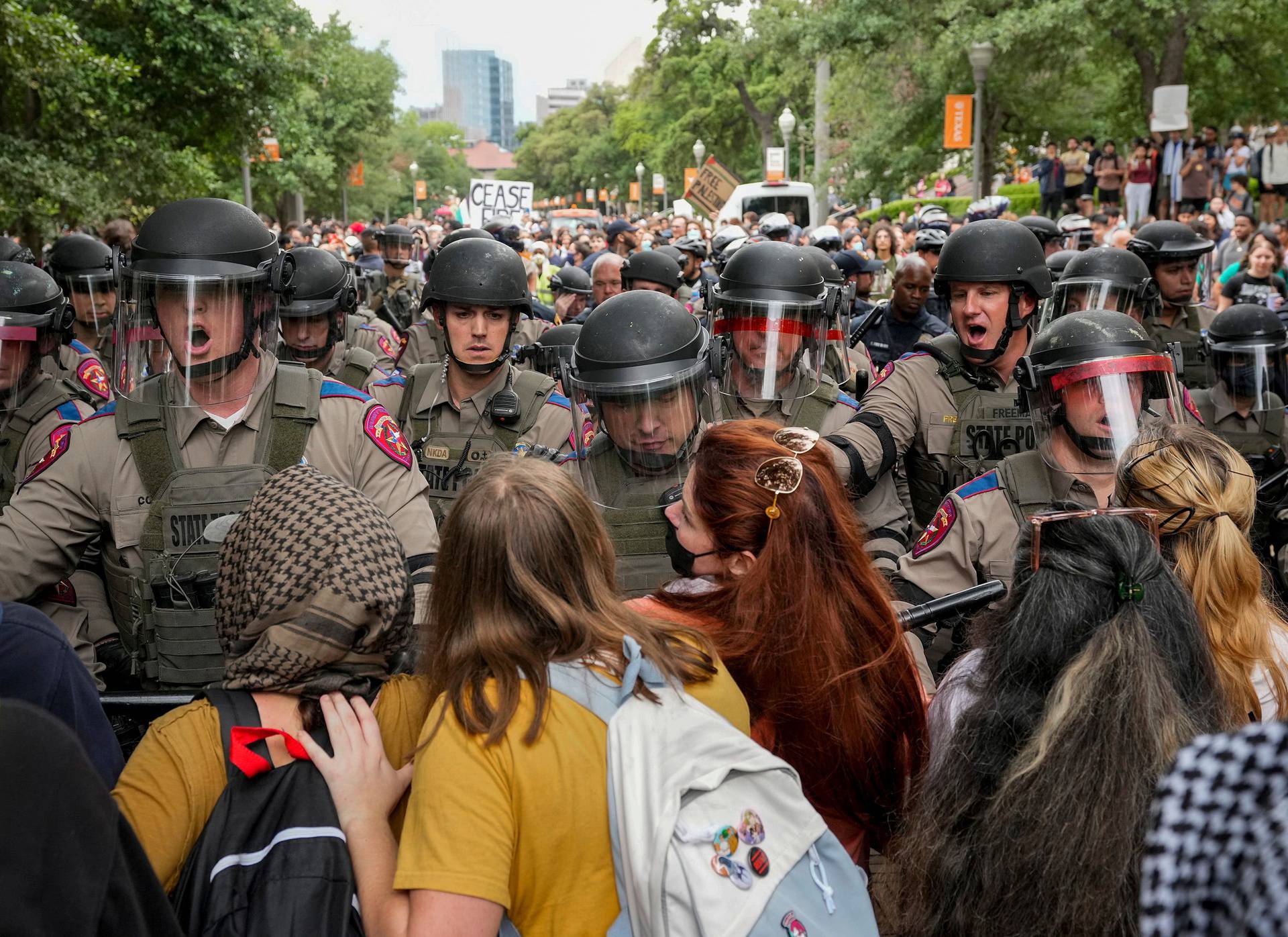 Texas state troopers in riot gear try to break up a pro-Palestinian protest at the University of Texas