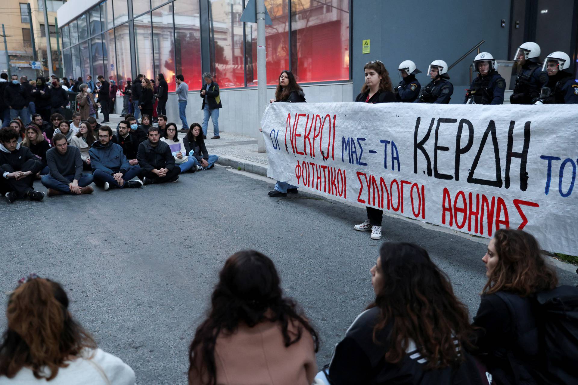 Protesters take part in a demonstration after a train crash near the city of Larissa, in Athens