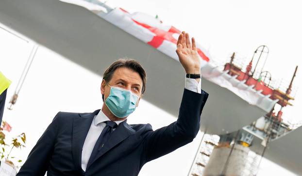 Italian Prime Minister Giuseppe Conte wearing a protective face mask attends the inauguration ceremony of the final section of Genoa