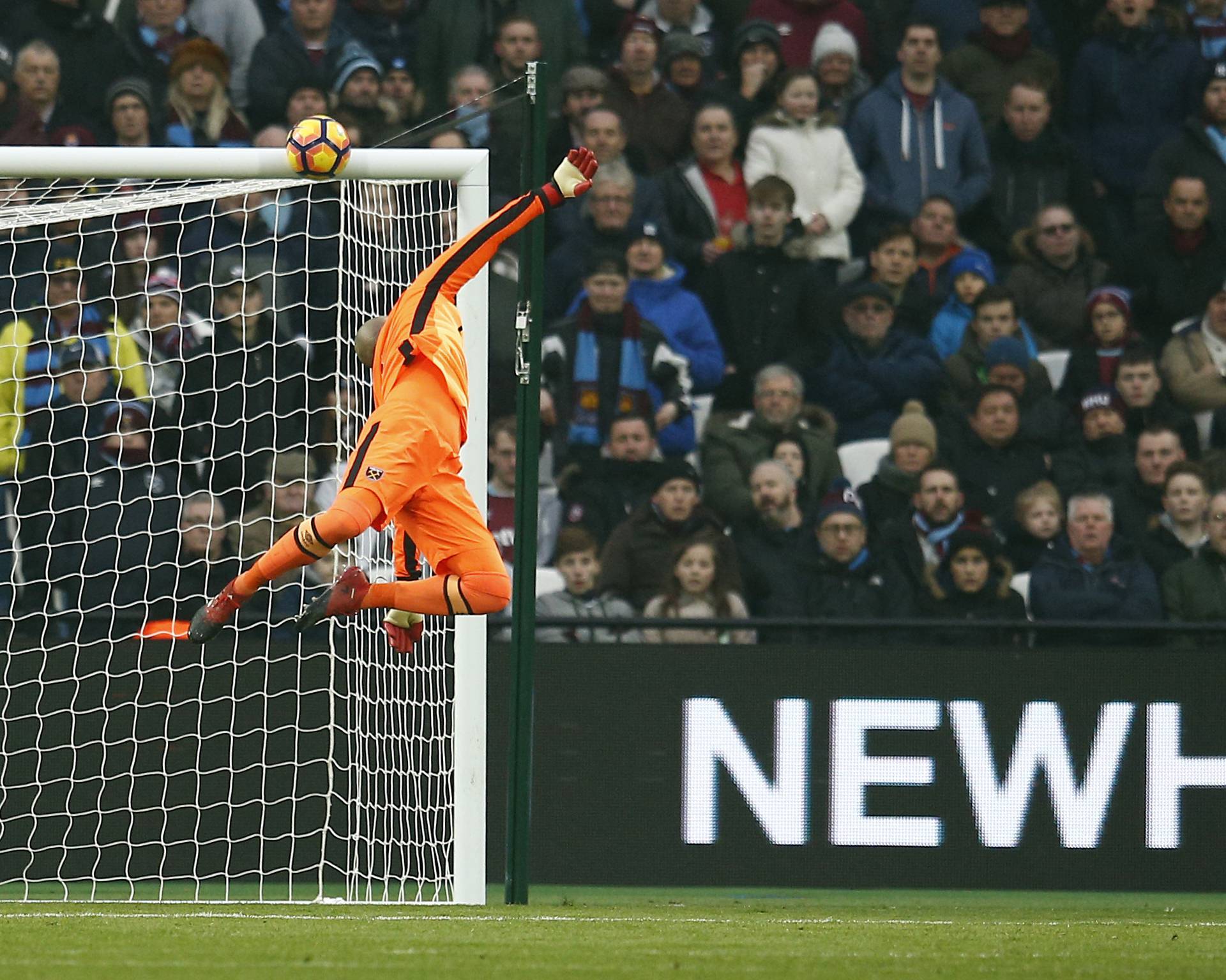 West Ham United's Darren Randolph dives to save a shot from West Bromwich Albion's Salomon Rondon that hits the crossbar