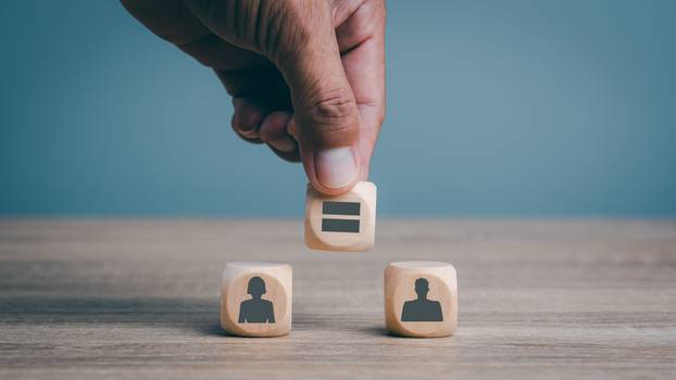 Man's,Hand,Is,Placing,Wooden,Blocks,On,The,Table,,Gender