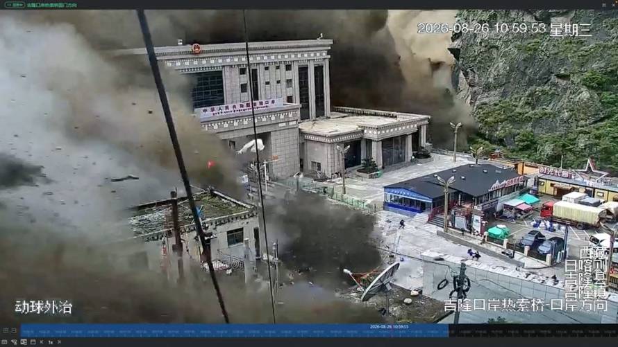 A CCTV footage shows people running away as wall of mud and water destroys buildings in a valley at Nepal-China border, in Gyirong