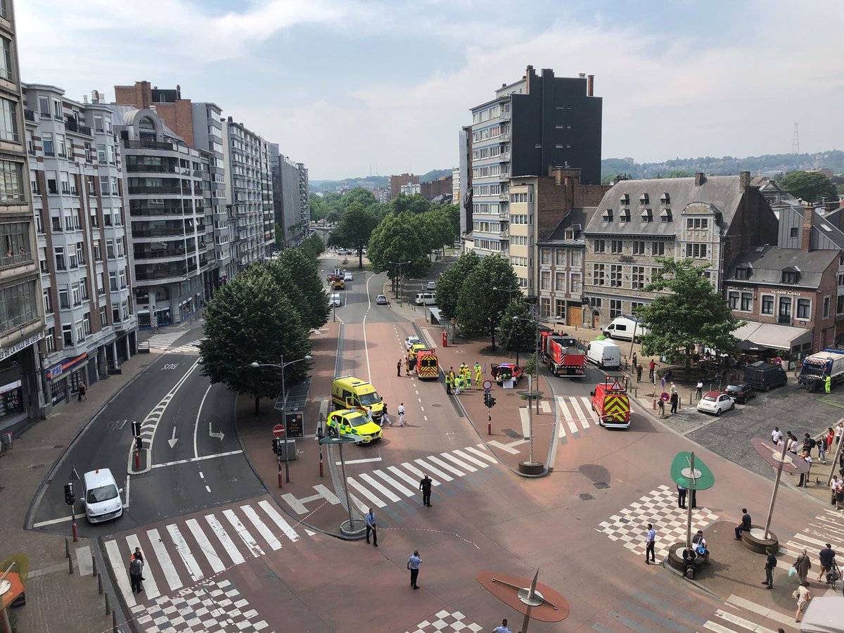 Emergency responders are seen following a shooting in Liege