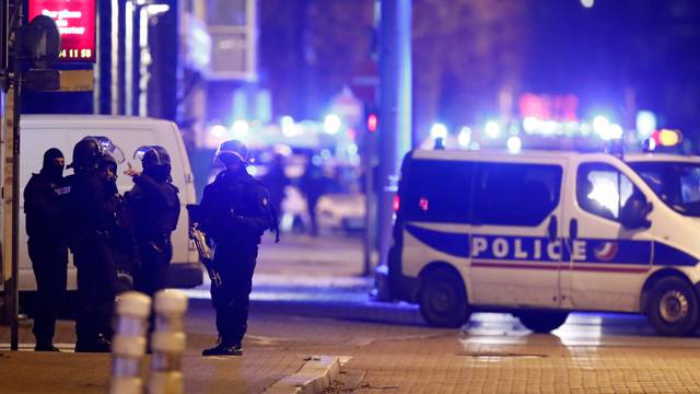 French special police forces secure an area during a police operation in the Meinau district after the deadly shooting in Strasbourg