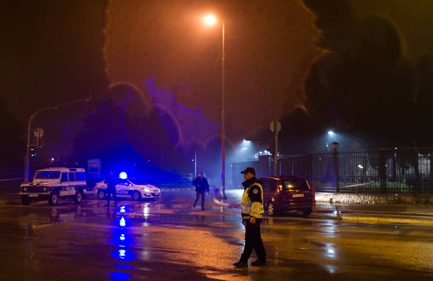 Police guard the entrance to the United States embassy building in Podgorica