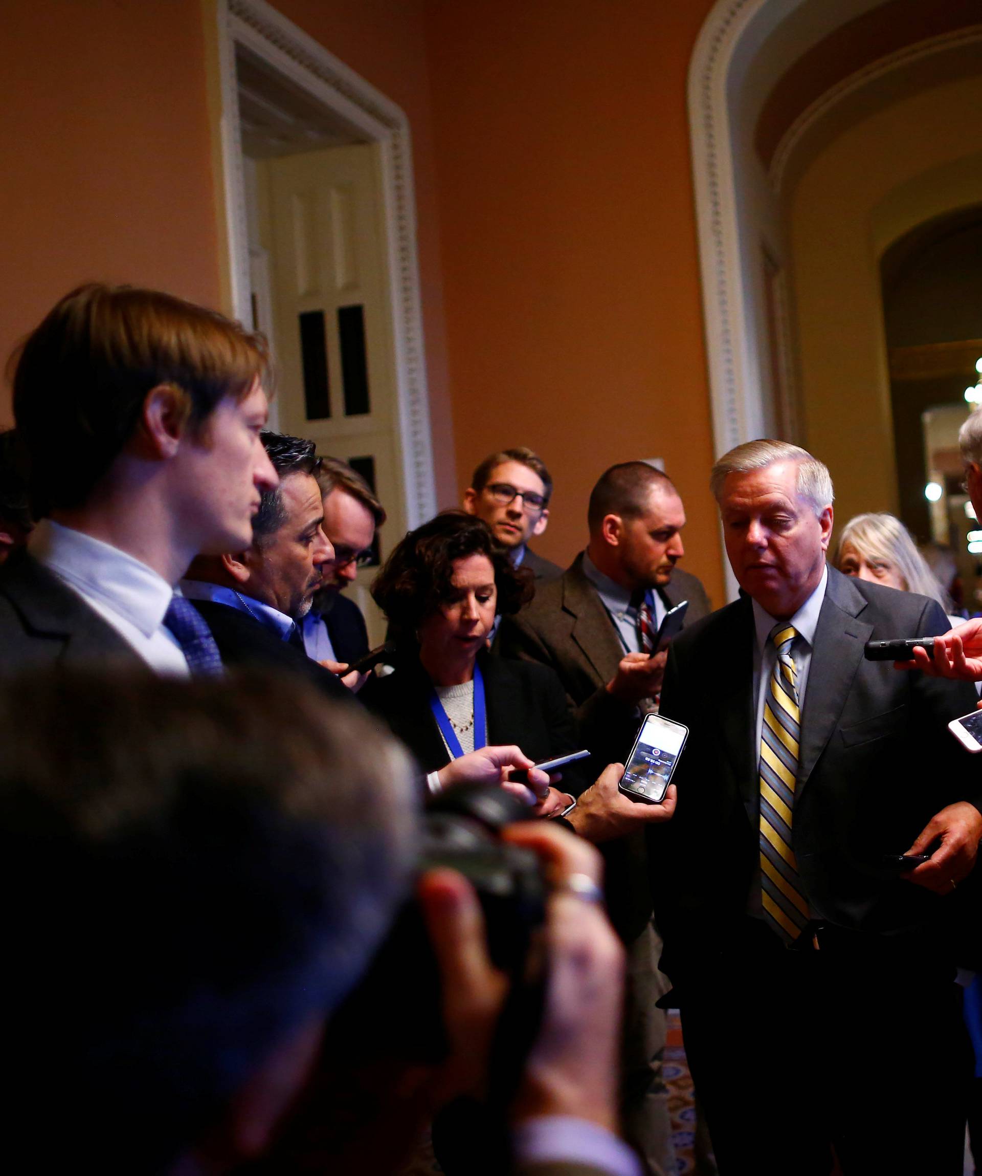 U.S. Sen. Lindsay Graham speaks to reporters outside the Senate chamber on Capitol Hill in Washington