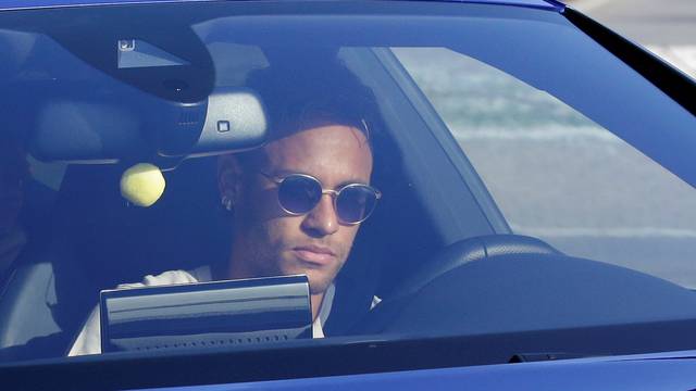 Brazilian soccer player Neymar drives to arrive to Joan Gamper training camp near Barcelona