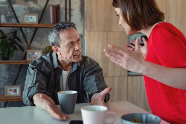 Mature grey-haired man feeling furious having conflict
